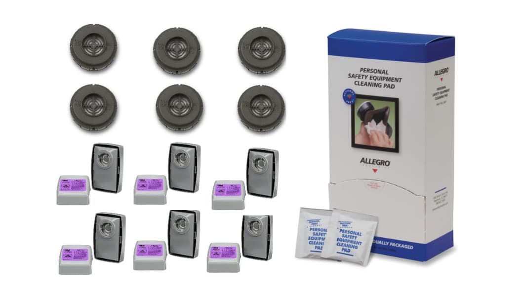 A picture of the mask cartridges, filters alongside a blue and white box of wipes, on a white background